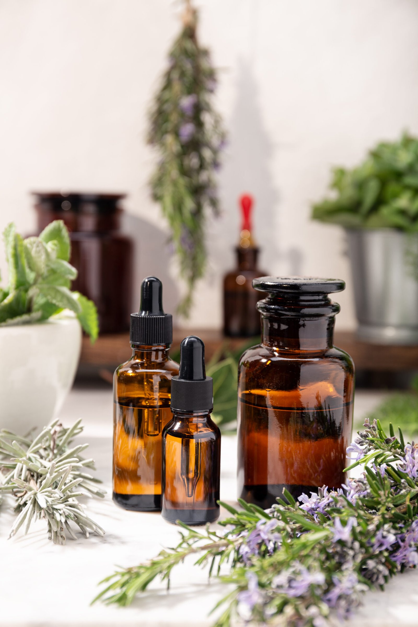 herbal essential oil on vintage apothecary bottles. herbal oil for skin care, aromatherapy and natural medicine